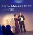 Picture of Adam Tear being awarded solicitor advocate of the year 2014